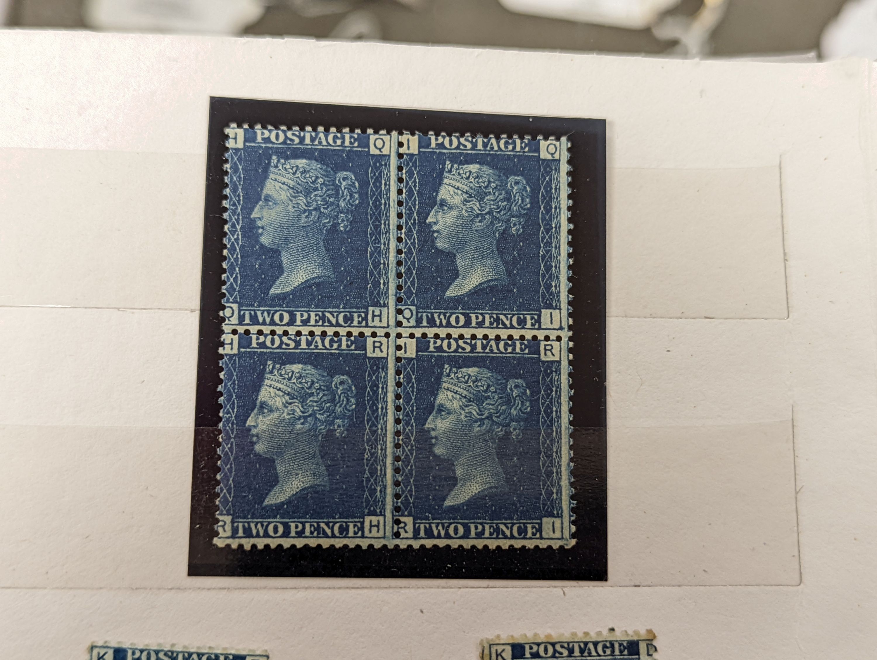 Great Britain - small stock book 2d blues with 1841 2d used strip of three, 6 singles used. 1858 2d plate 13 and plate 14 mint blocks of four